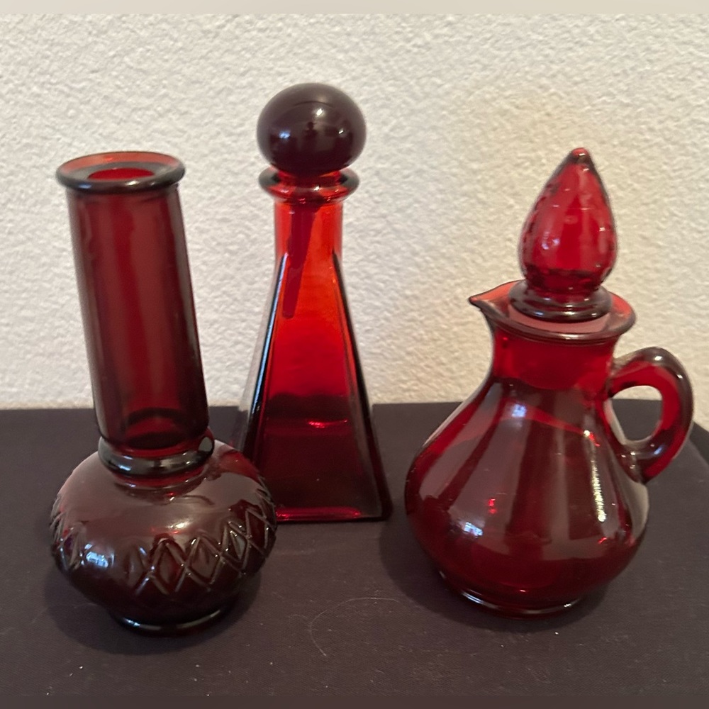 3 Vintage bottles ruby red glass. (2 are definitely Avon)